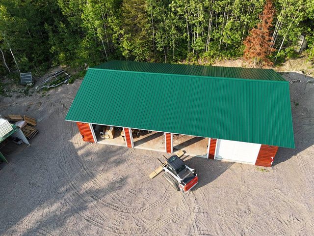 Cuttle Lake Resort, aerial still, 2026-07-10: the workshop and its yard from above