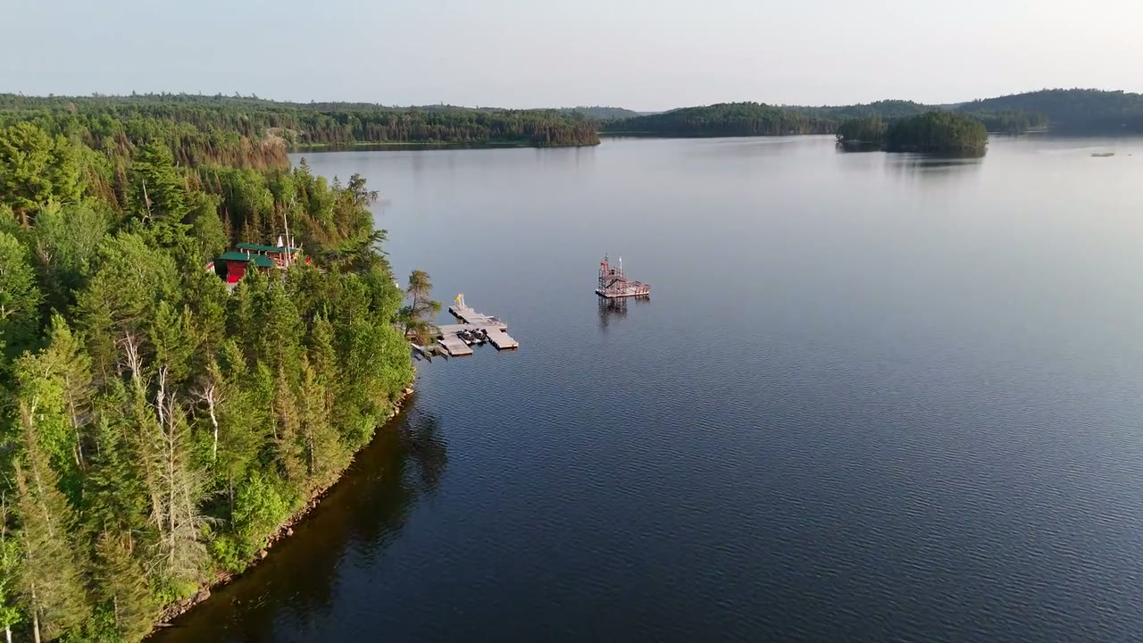 Cuttle Lake Resort camp, a frame from the 3D flythrough rendered from the 2026-07-10 orthomosaic and mesh
